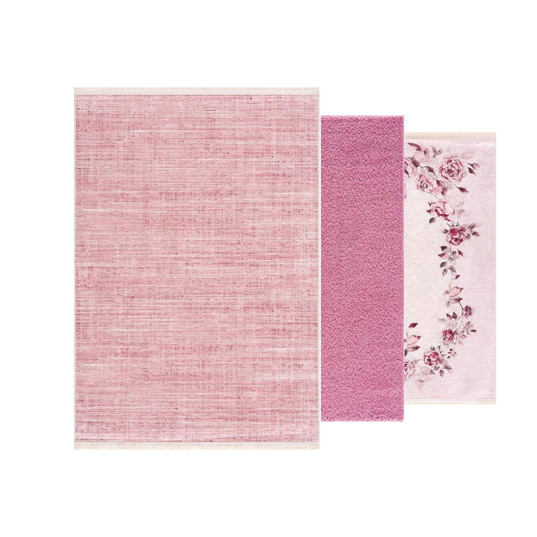Three pink rugs with various textures and floral designs, perfect for home decor.