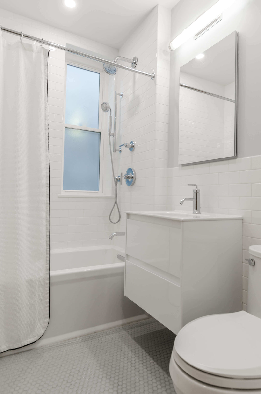 Modern bathroom design featuring a sleek tub, shower, and stylish fixtures with natural light.