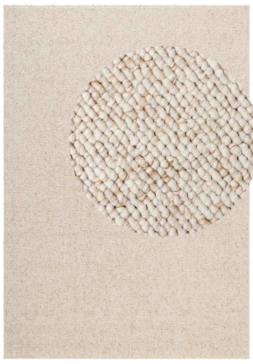 Cream flatweave Rocco rug with a wool-look plain design, in a British living room