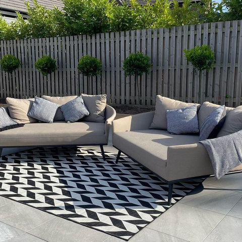 Outdoor rug styled on a garden patio