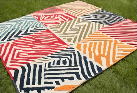 Plastic outdoor rug styled on a patio