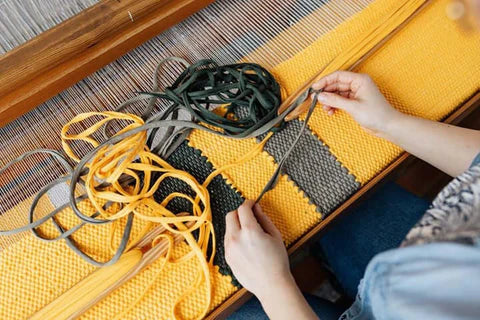 Yellow and grey rug styled in a home