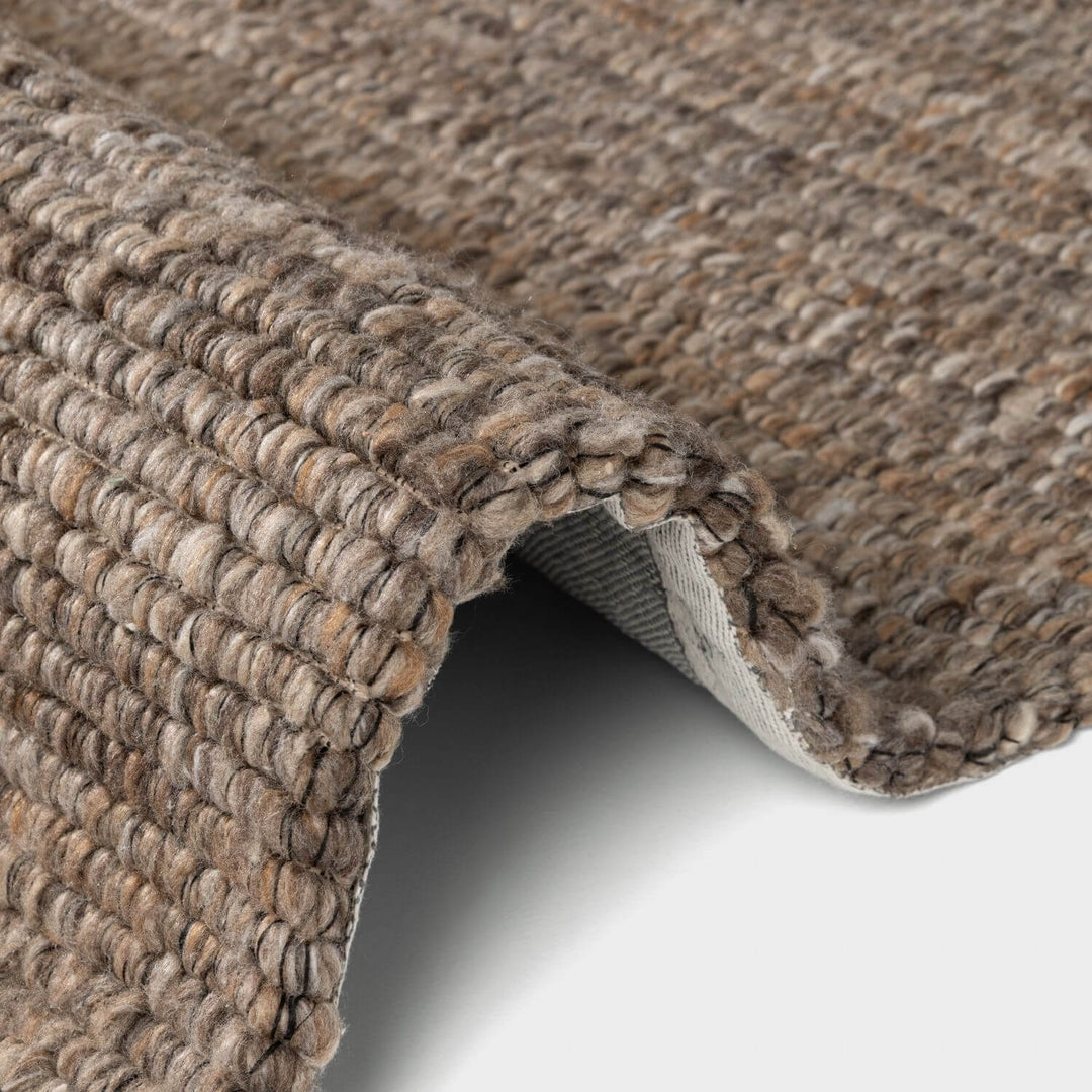 Brown colour rug, weave design, durable softness, hand-made, cotton backing, wool-effect, easy care.