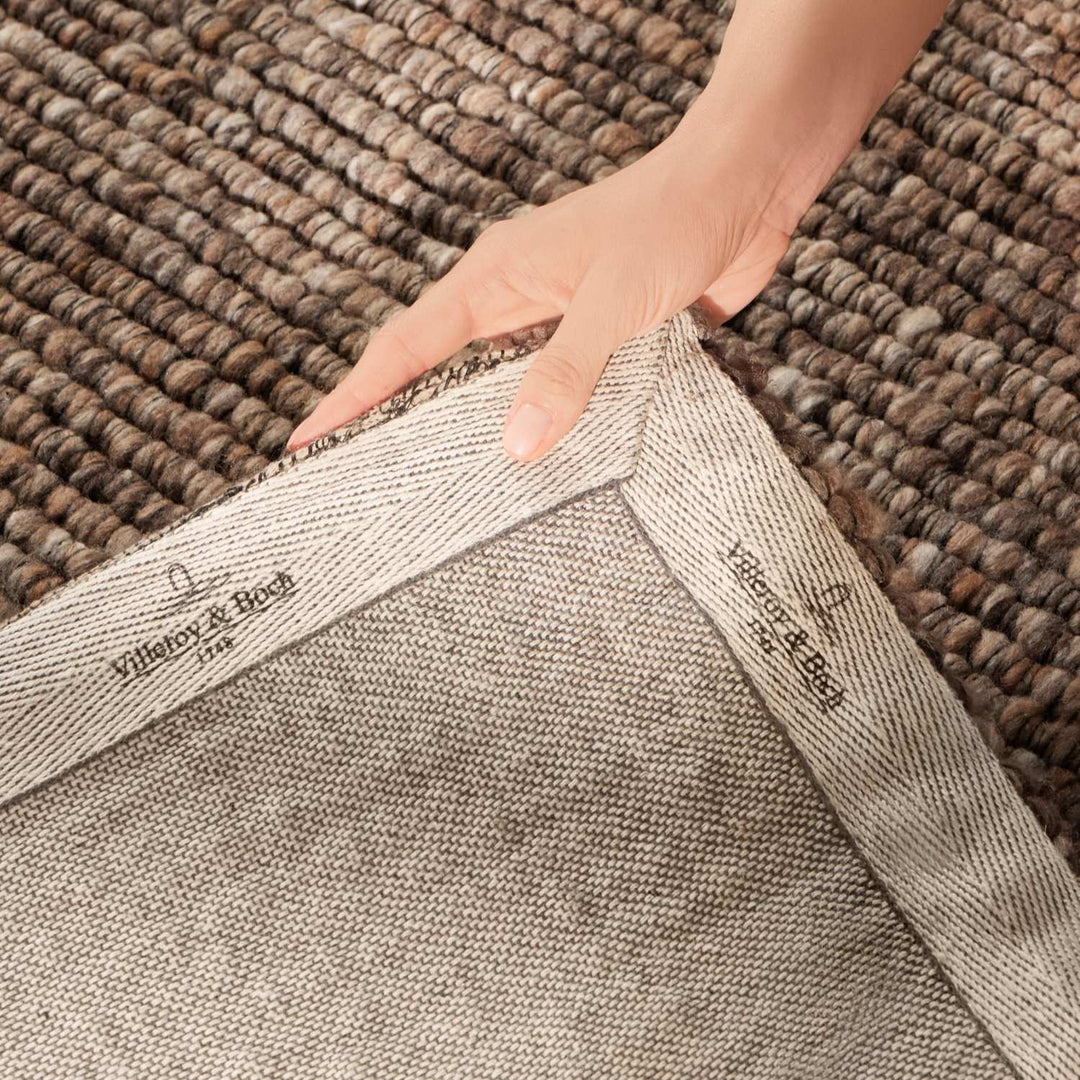 Brown colour rug, weave design, durable softness, hand-made, cotton backing, wool-effect, easy care.