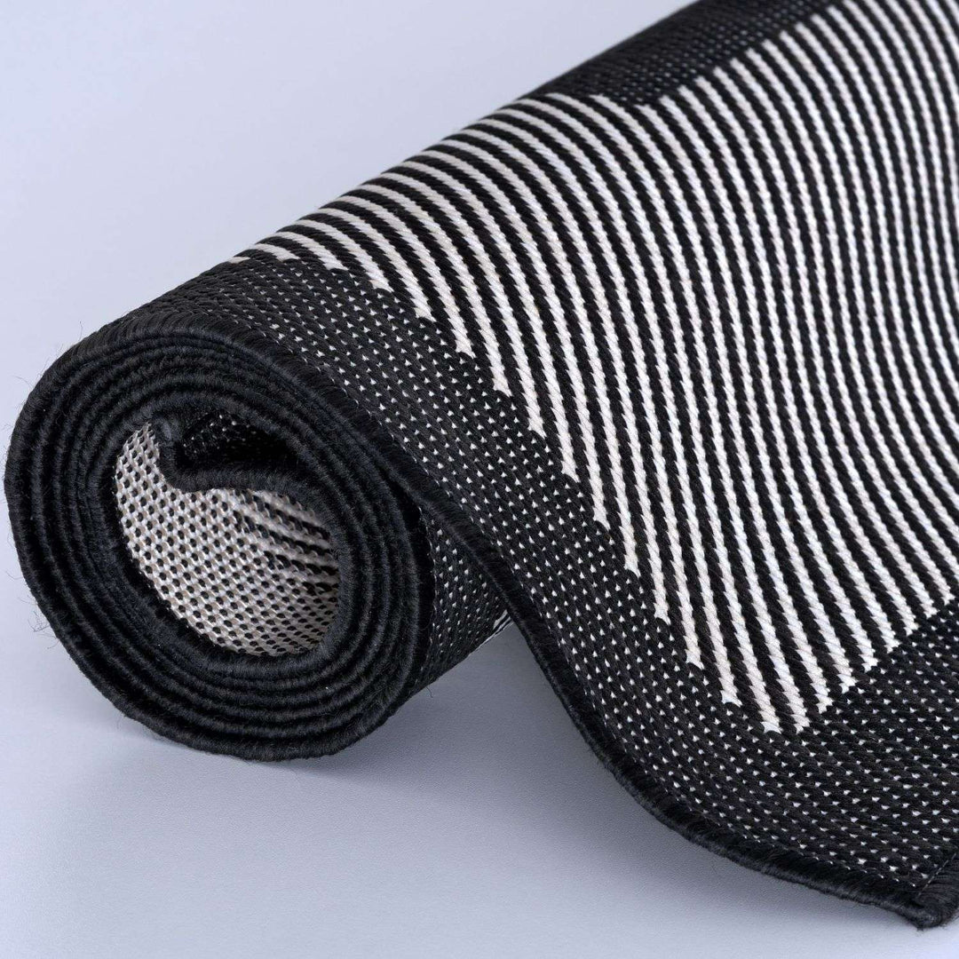 Outdoor Black Bordered Rug Weather resistant, Durable.
