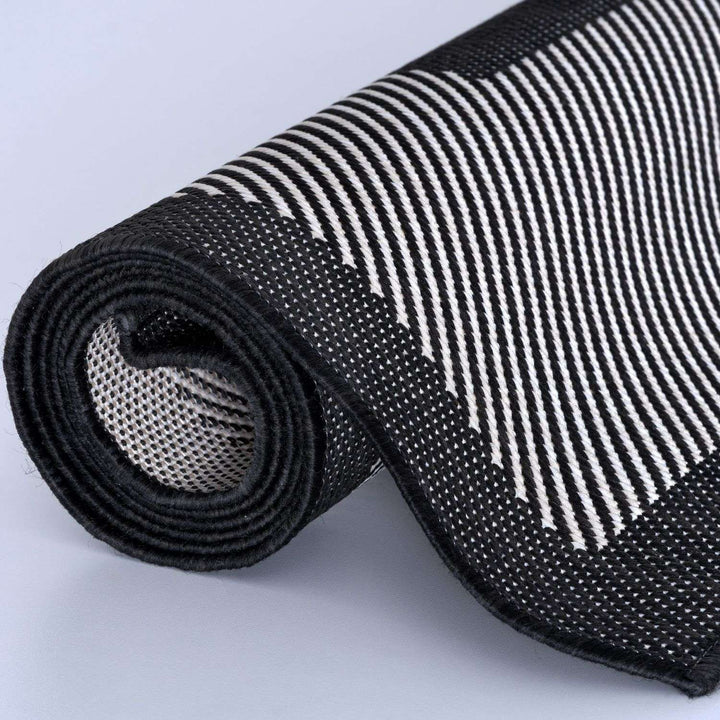Outdoor Black Bordered Rug Weather resistant, Durable.
