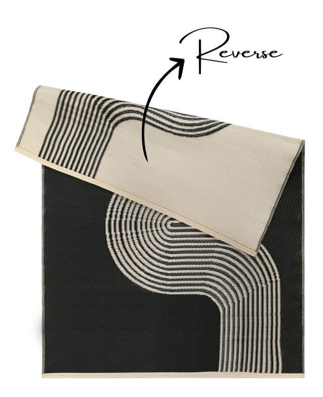 Urban Outdoor Rug in black and beige with geometric design, showcasing reversible feature for versatile outdoor decor.