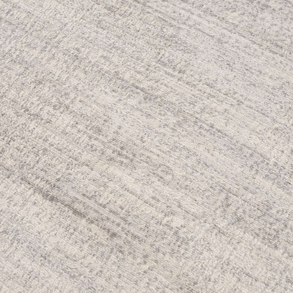 cream and grey rug features an abstract pattern