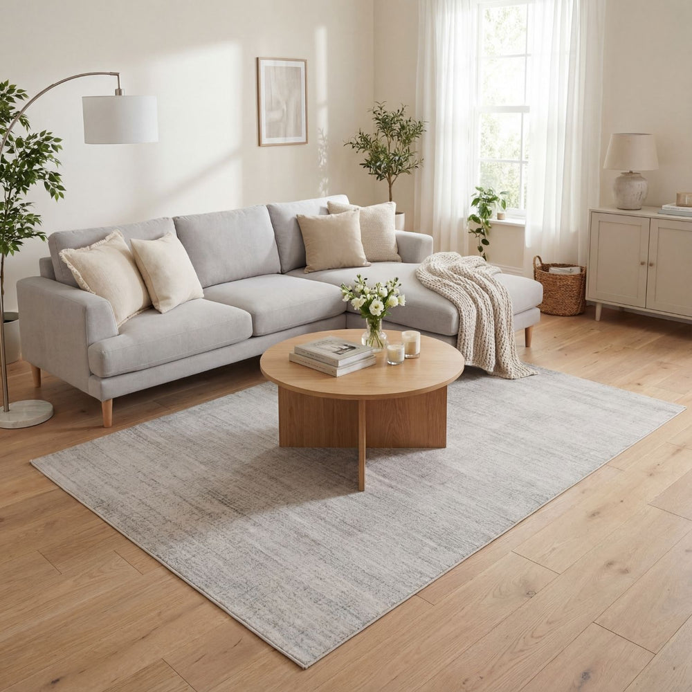 cream and grey rug features an abstract pattern
