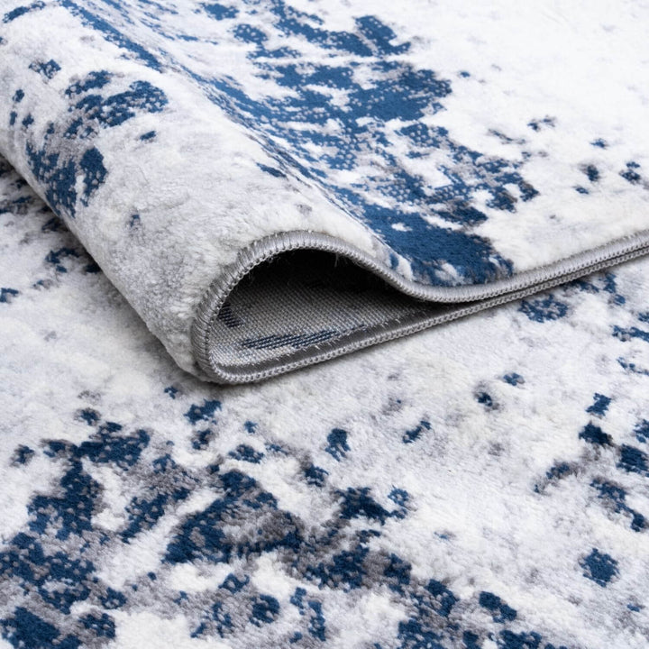 Elaris navy abstract rug, jute backing, anti-static, non-shedding | The Rugs