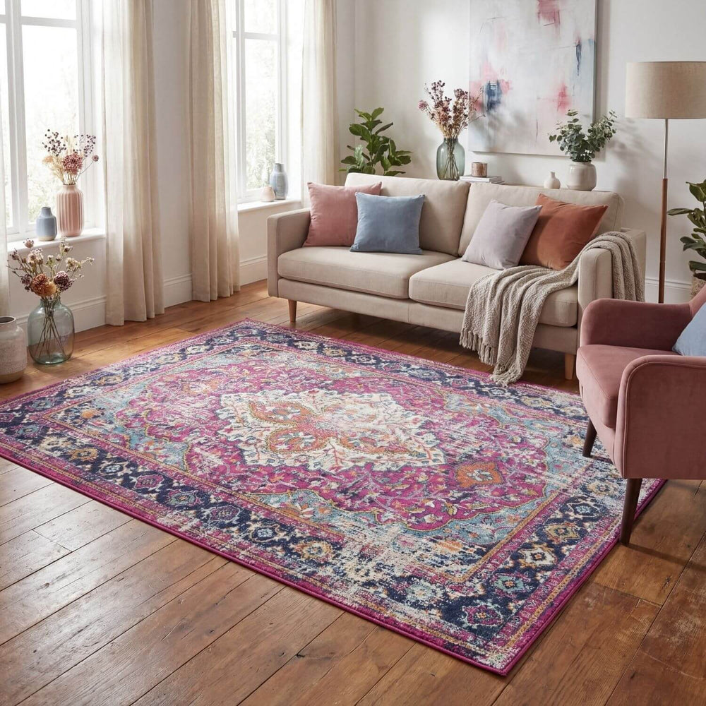 Living room with a patterned rug, sofa, and decorative elements.