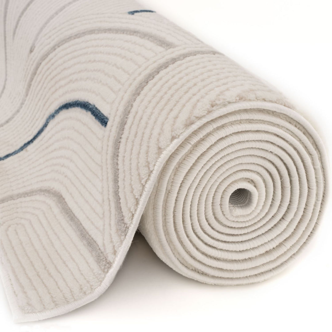 Living Room rug, blue-cream colours, geometric, practicality in mind, the rug is anti-allergic.