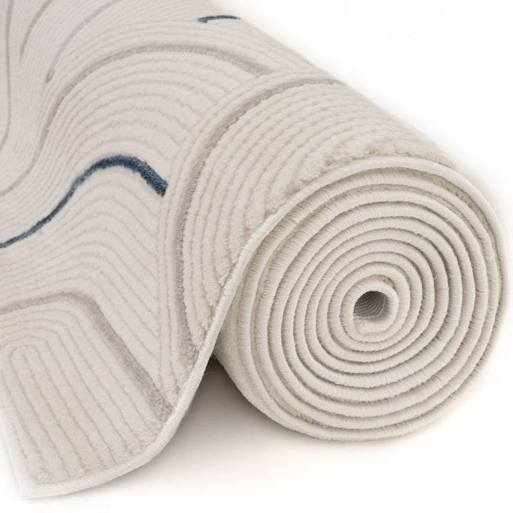 Living Room rug, blue-cream colours, geometric, practicality in mind, the rug is anti-allergic.