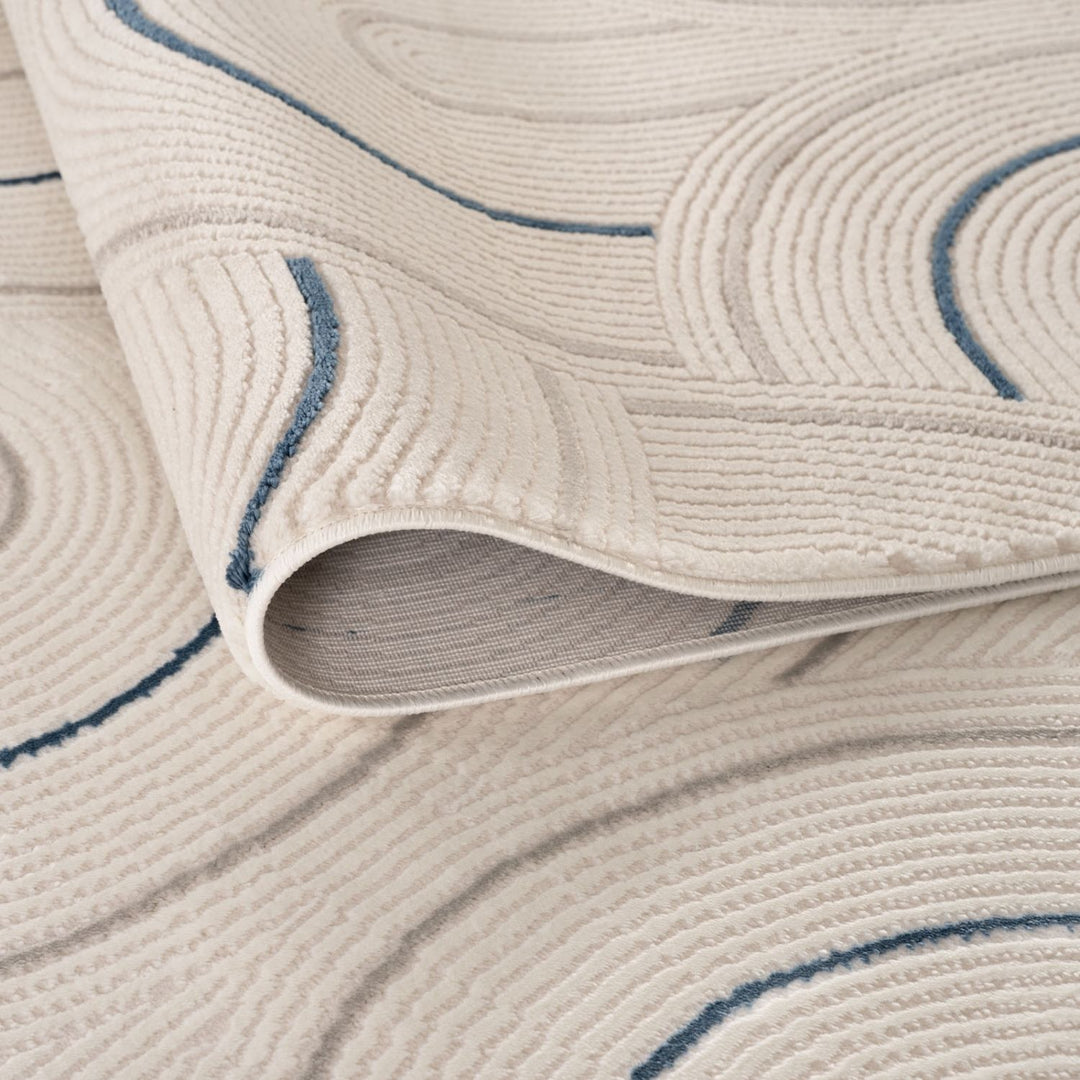 Living Room rug, blue-cream colours, geometric, practicality in mind, the rug is anti-allergic.