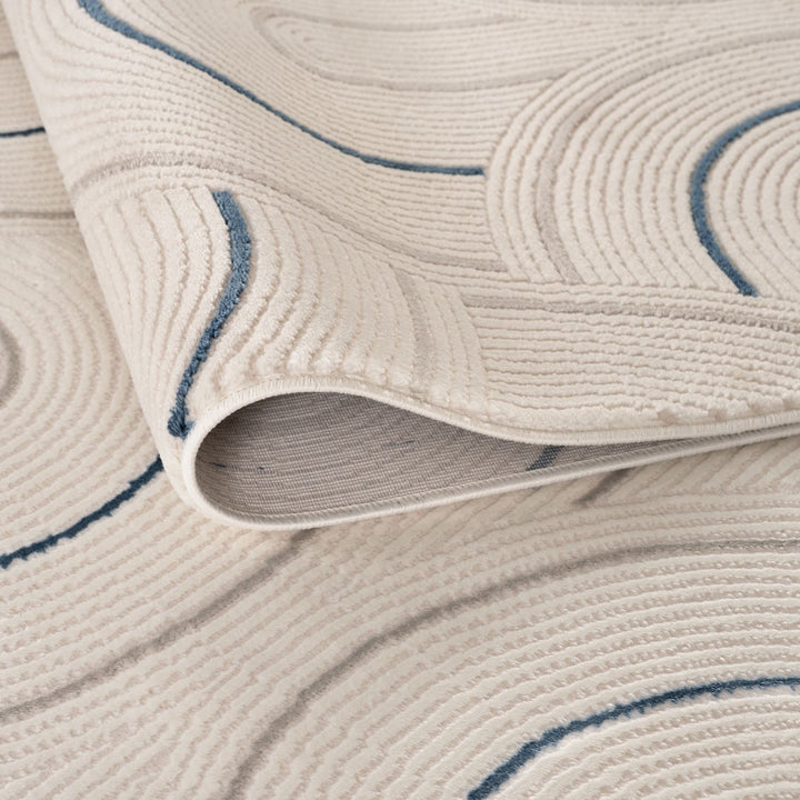 Living Room rug, blue-cream colours, geometric, practicality in mind, the rug is anti-allergic.