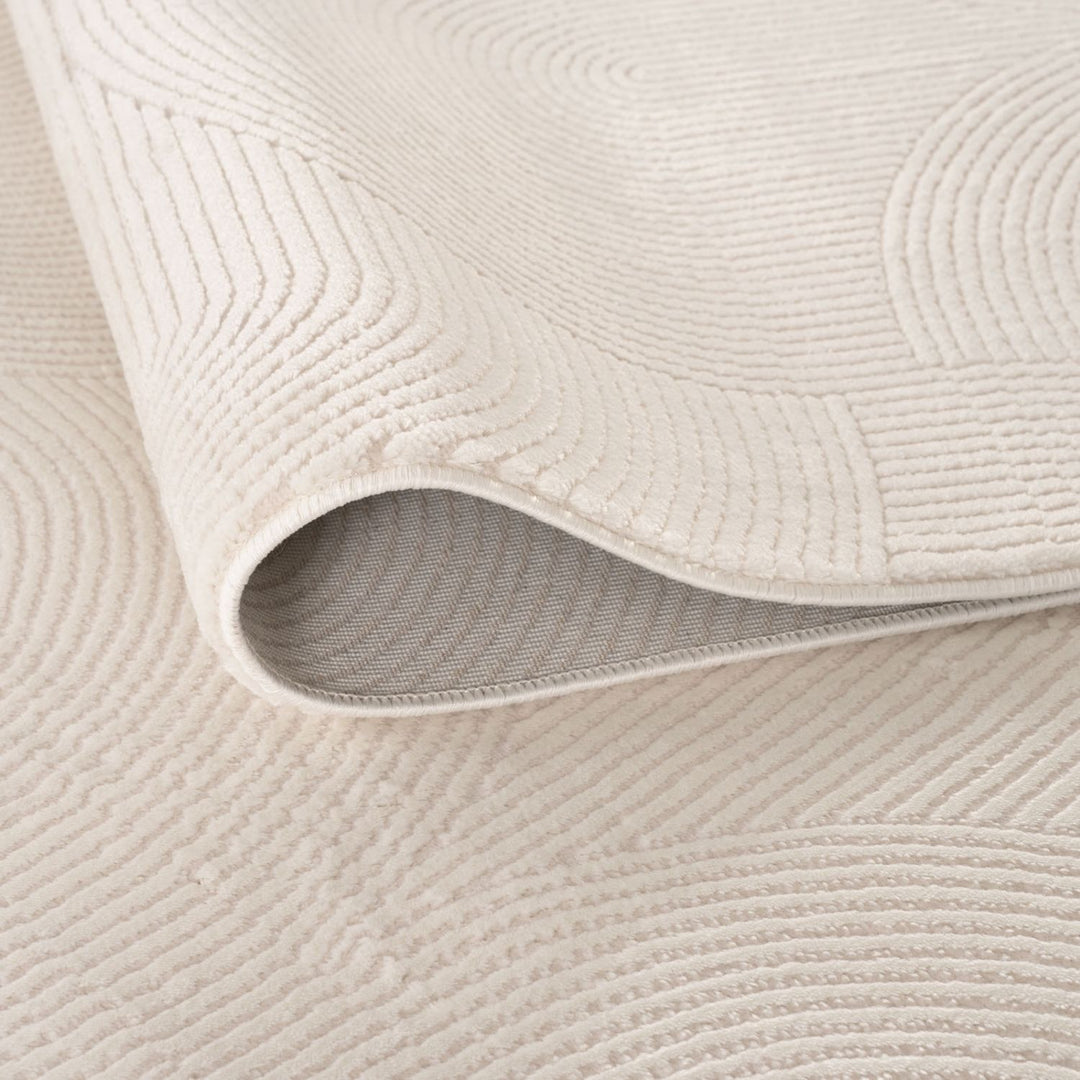 Living Room rug, cream colours, geometric, practicality in mind, the rug is anti-allergic.