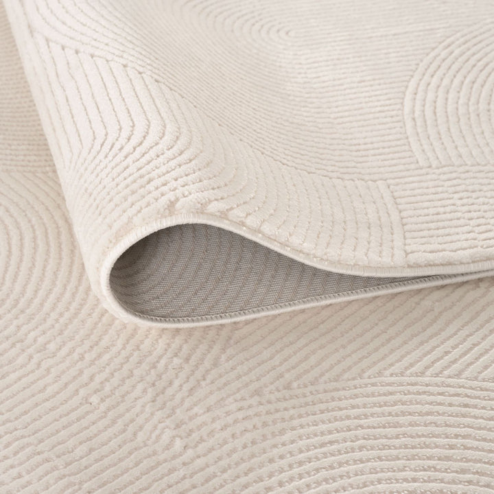 Living Room rug, cream colours, geometric, practicality in mind, the rug is anti-allergic.