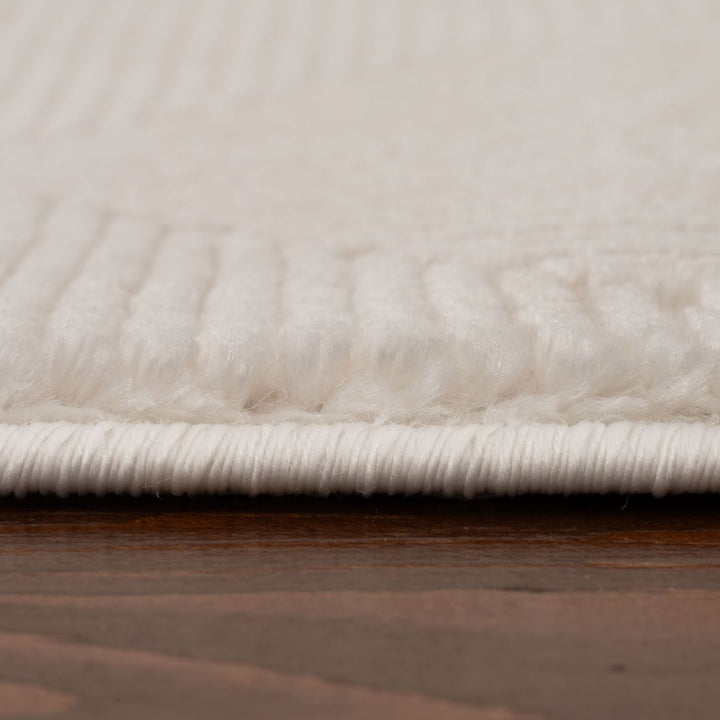 Living Room rug, cream colours, geometric, practicality in mind, the rug is anti-allergic.