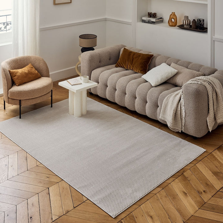 Living Room rug, beige-cream colours, dots, practicality in mind, the rug is anti-allergic.
