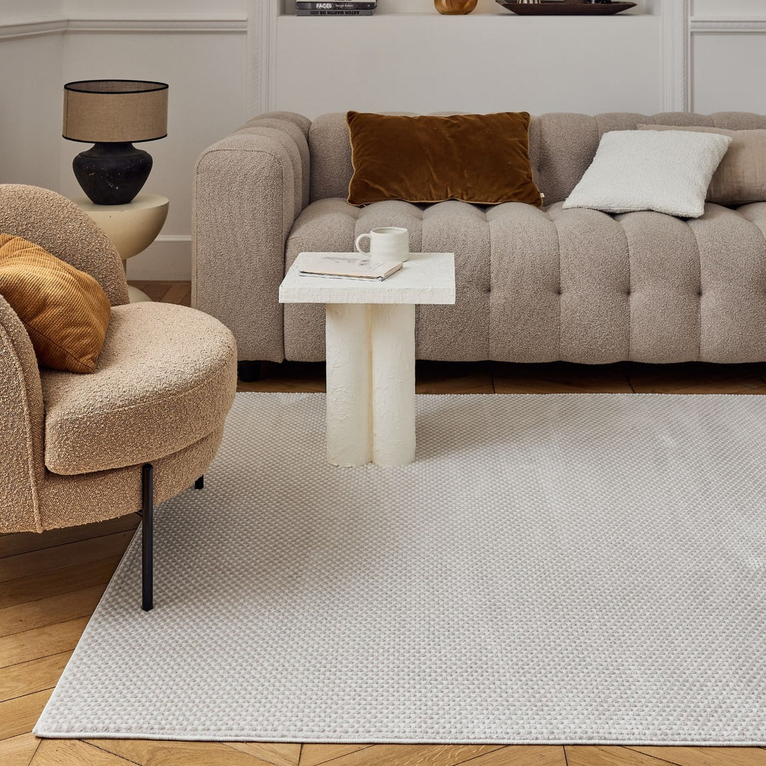 Living Room rug, beige-cream colours, dots, practicality in mind, the rug is anti-allergic.