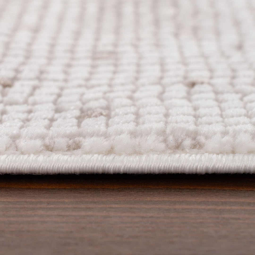 Living Room rug, beige-cream colours, dots, practicality in mind, the rug is anti-allergic.