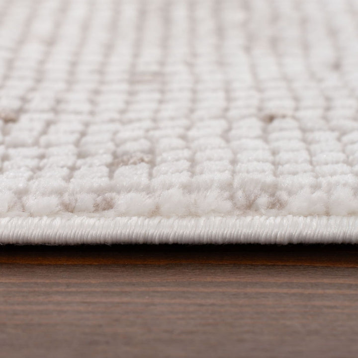 Living Room rug, beige-cream colours, dots, practicality in mind, the rug is anti-allergic.