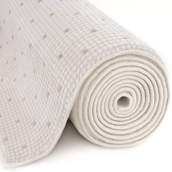 Living Room rug, beige-cream colours, dots, practicality in mind, the rug is anti-allergic.
