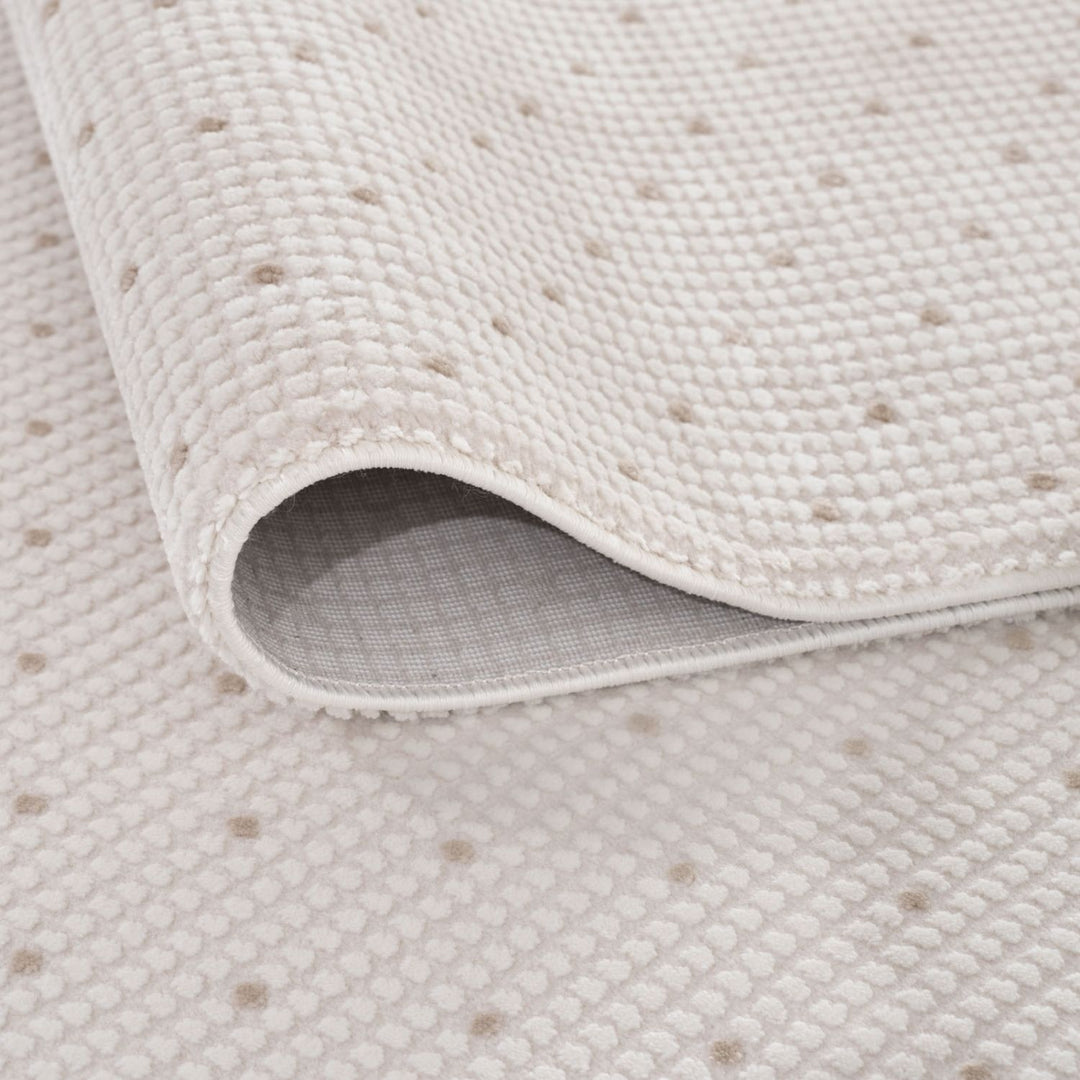 Living Room rug, beige-cream colours, dots, practicality in mind, the rug is anti-allergic.