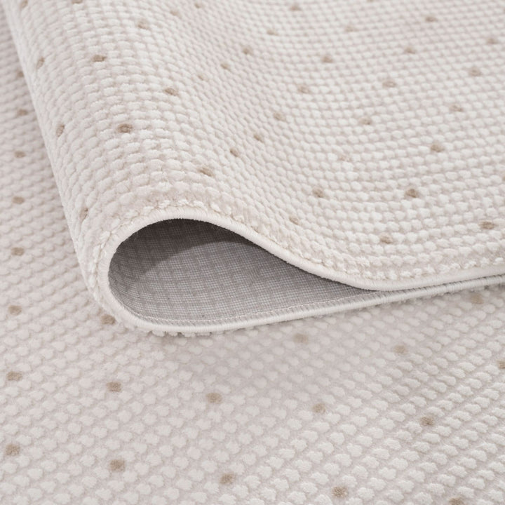Living Room rug, beige-cream colours, dots, practicality in mind, the rug is anti-allergic.