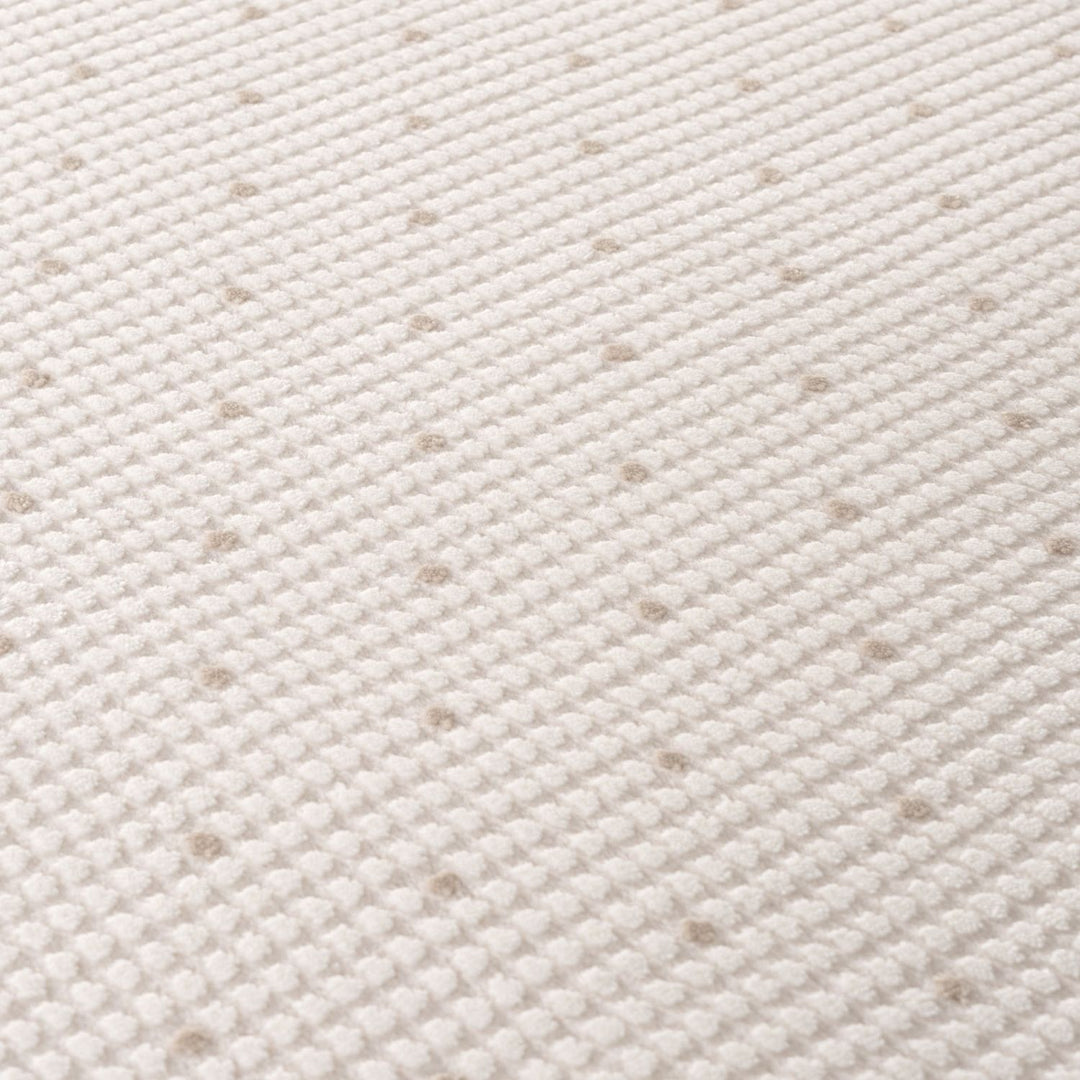 Living Room rug, beige-cream colours, dots, practicality in mind, the rug is anti-allergic.