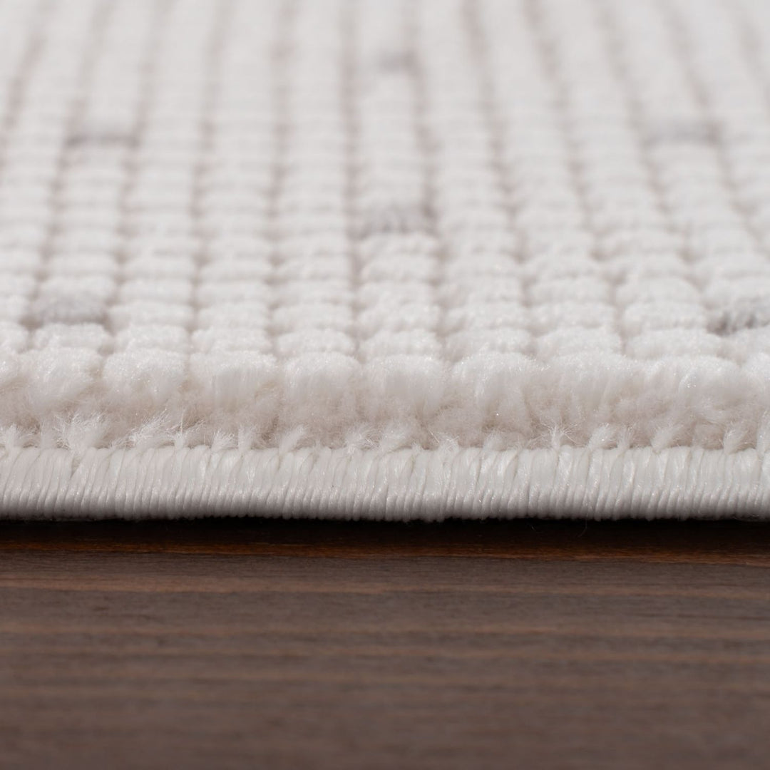 Living Room rug, grey-cream colours, dots, practicality in mind, the rug is anti-allergic.