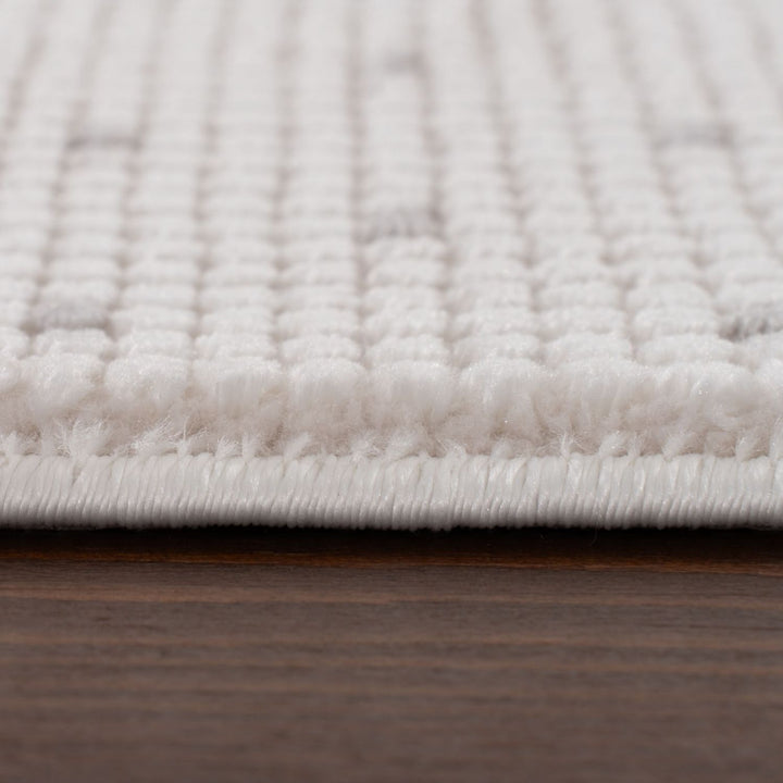 Living Room rug, grey-cream colours, dots, practicality in mind, the rug is anti-allergic.
