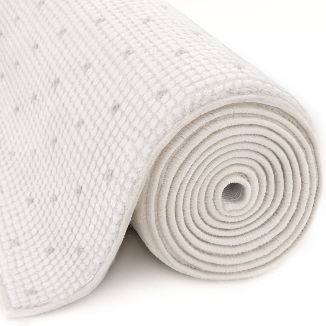 Living Room rug, grey-cream colours, dots, practicality in mind, the rug is anti-allergic.