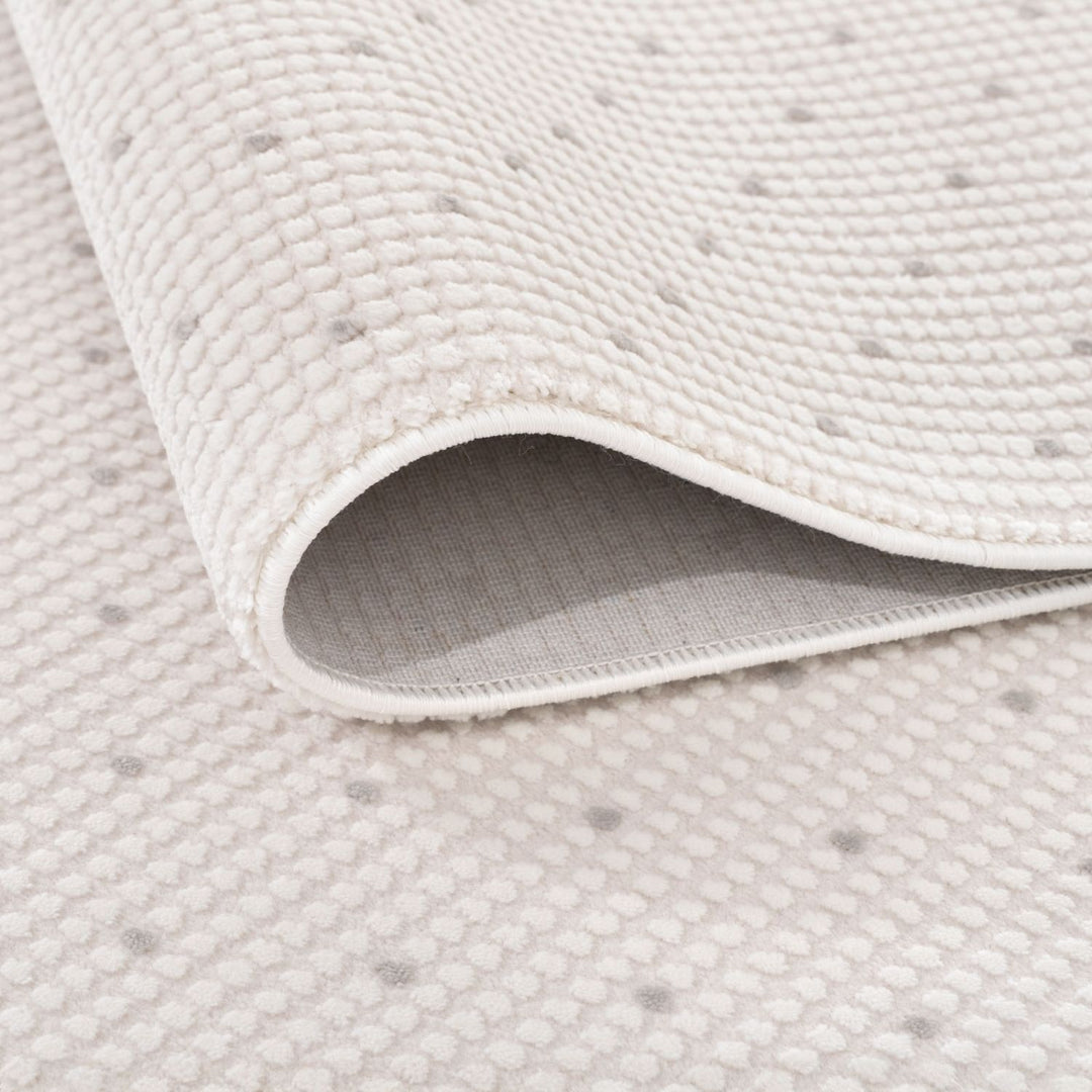 Living Room rug, grey-cream colours, dots, practicality in mind, the rug is anti-allergic.