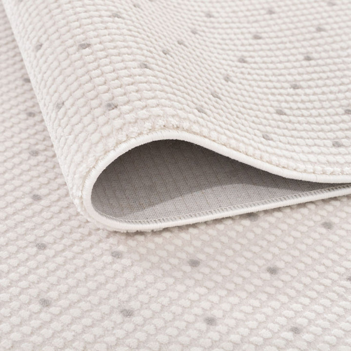 Living Room rug, grey-cream colours, dots, practicality in mind, the rug is anti-allergic.
