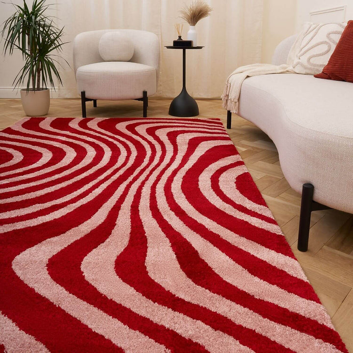 Red and pink wavy striped patterned rug