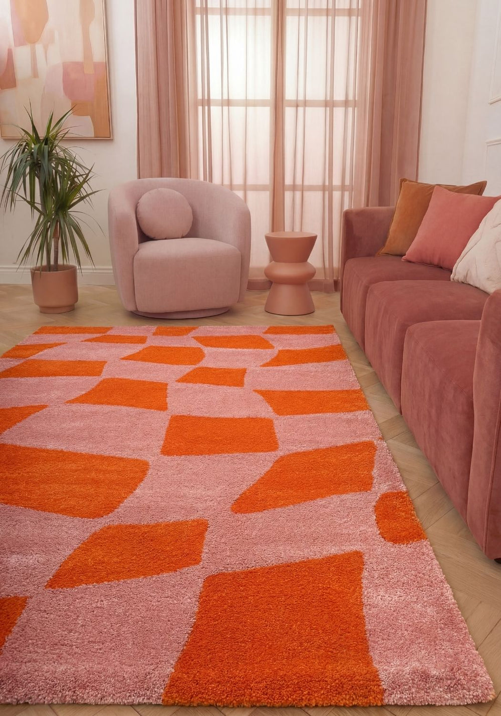Patterned fabric with orange geometric shapes, living room.