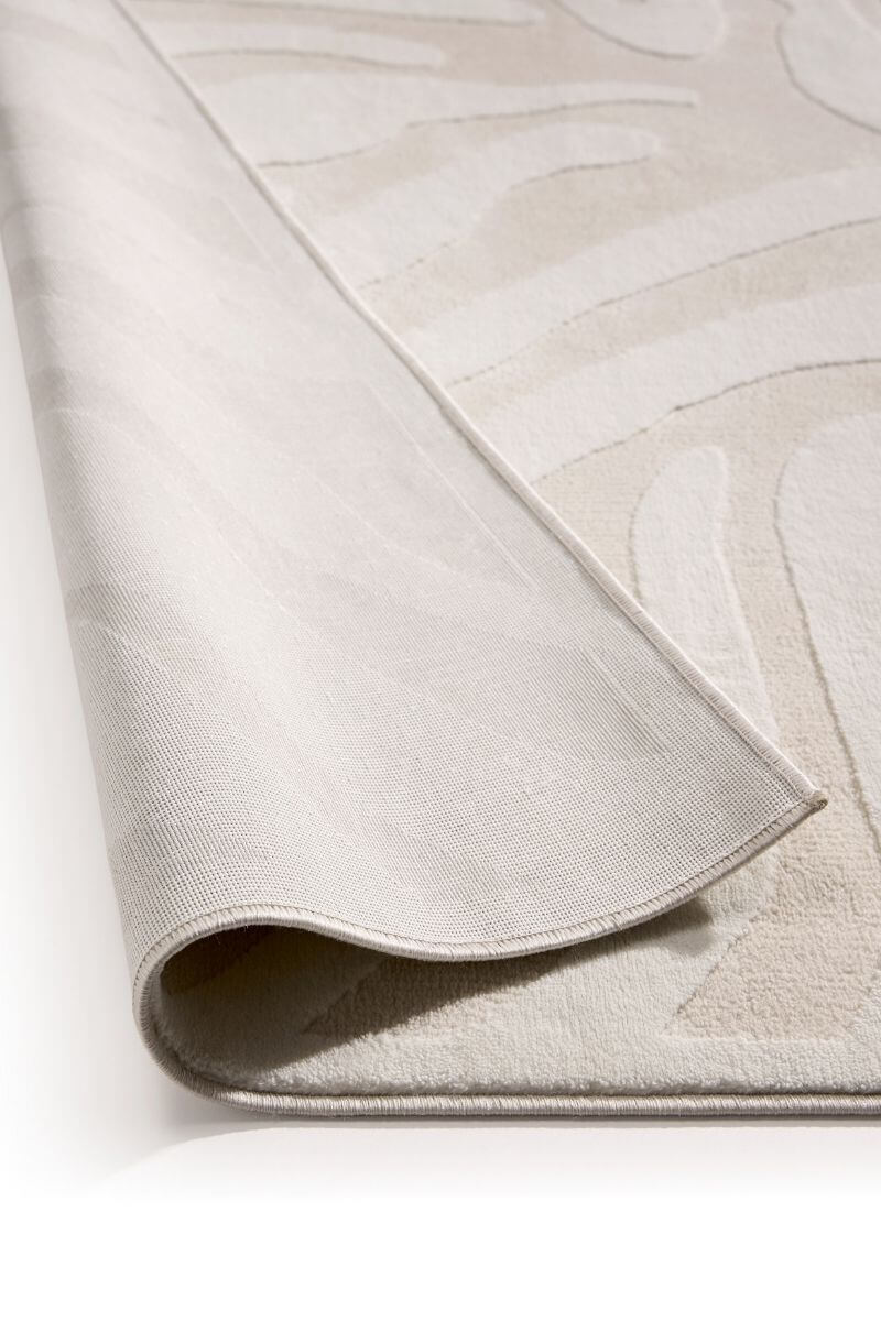 Abstract geometric rug in cream shades, showcasing a soft texture and modern design.