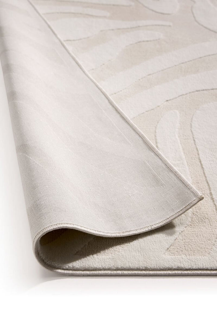Abstract geometric rug in cream shades, showcasing a soft texture and modern design.