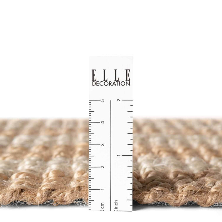 Textured material swatch with a ruler and 'ELLE DECORATION' branding.