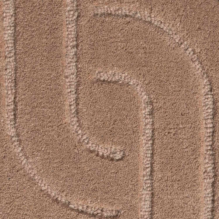 Close-up of a textured brown surface with a pattern