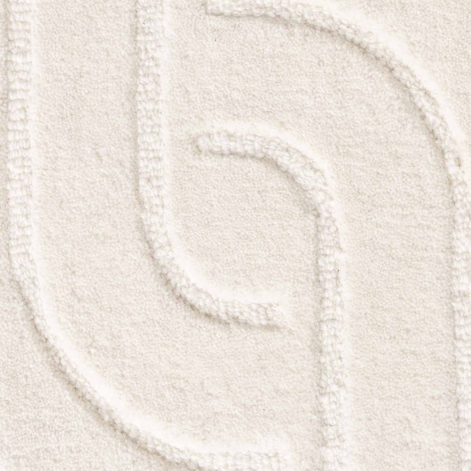 Close-up of a textured white yarn swatch
