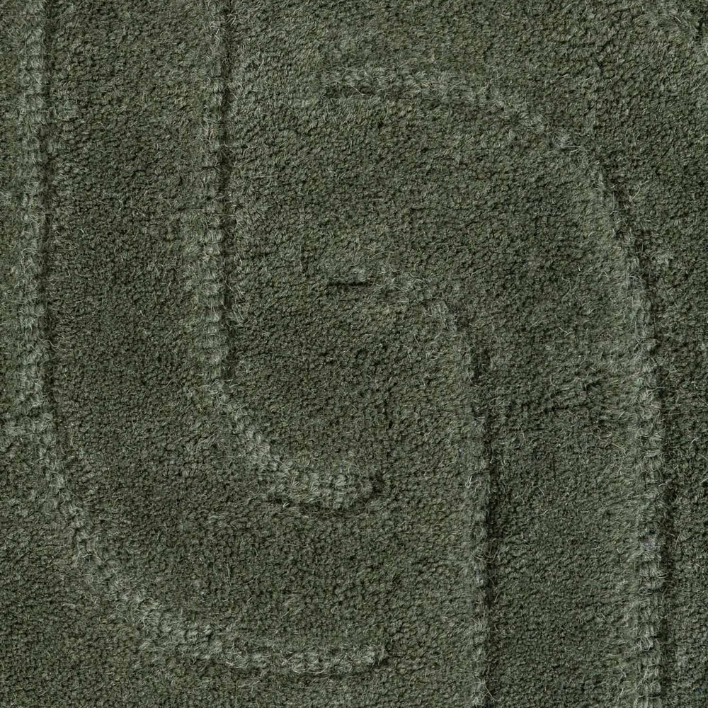 Close-up of a textured green fabric surface