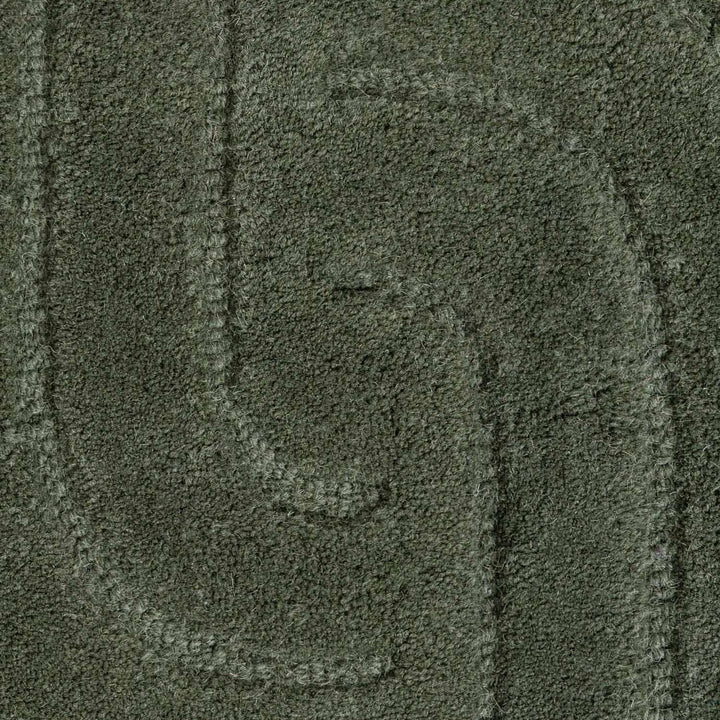 Close-up of a textured green fabric surface