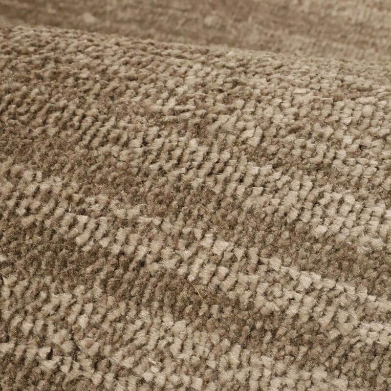 Close-up of the Arlo Textured Rug in brown tone stripes, showcasing soft polyester material and unique texture.