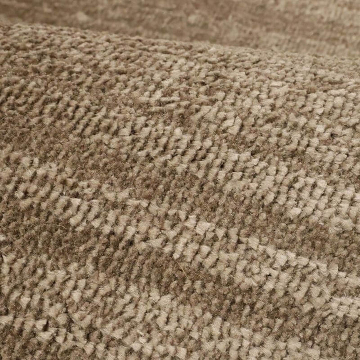 Close-up of the Arlo Textured Rug in brown tone stripes, showcasing soft polyester material and unique texture.