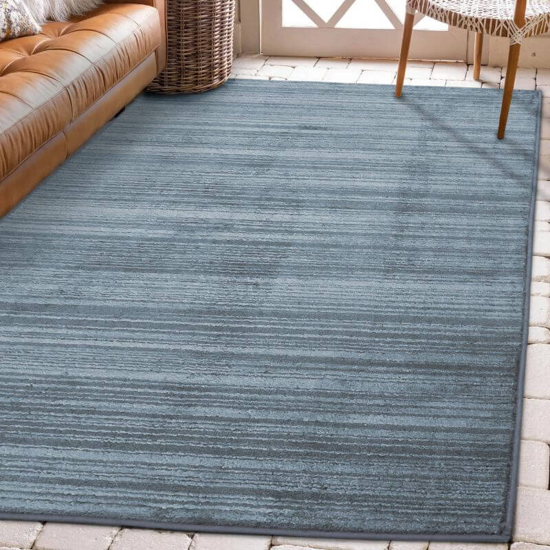 Arlo Textured Rug in soft blue tone, featuring subtle stripes, enhancing interior sophistication and comfort.