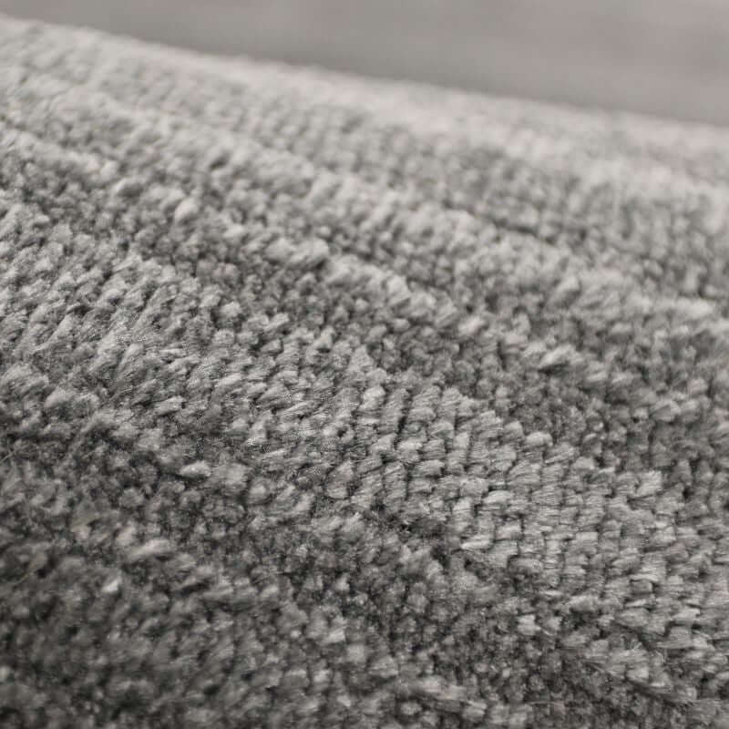 Close-up of Arlo Textured Rug in grey, showcasing soft tone stripes and plush 10mm pile for comfort and style.