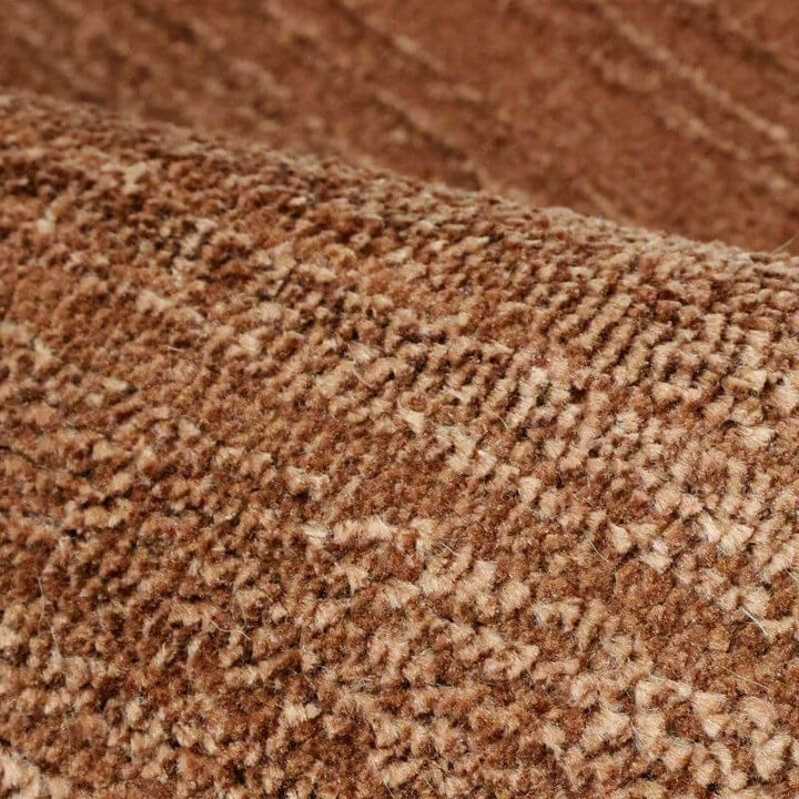 Close-up of the Arlo Textured Rug in brown, featuring a soft pile and subtle striped texture for stylish interiors.