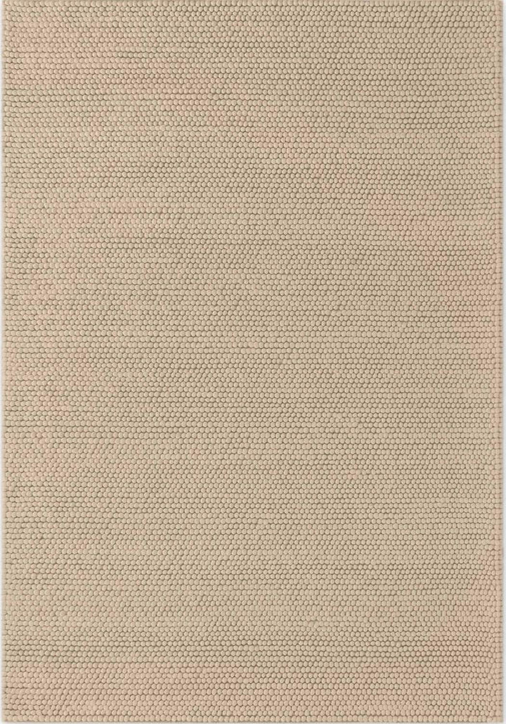 Beige textured rug with a subtle pattern
